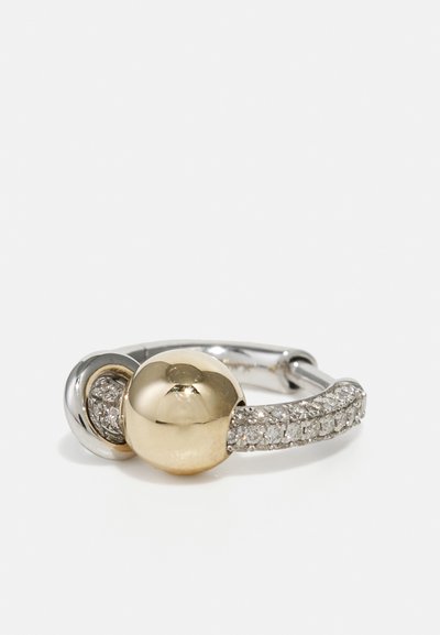 Gold and silver ring with a smooth, round golden ball and a band encrusted with small, clear gemstones, featuring a polished finish.