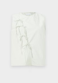 Top senza maniche di colore verde chiaro con design avvolgente, caratterizzato da nastri decorativi sul lato sinistro e un collo a giro. Realizzato in un tessuto morbido.