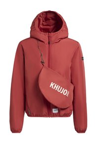 Red windbreaker jacket with a hood, featuring a zip closure and elastic cuffs. Includes a detachable, matching bag with white lettering.