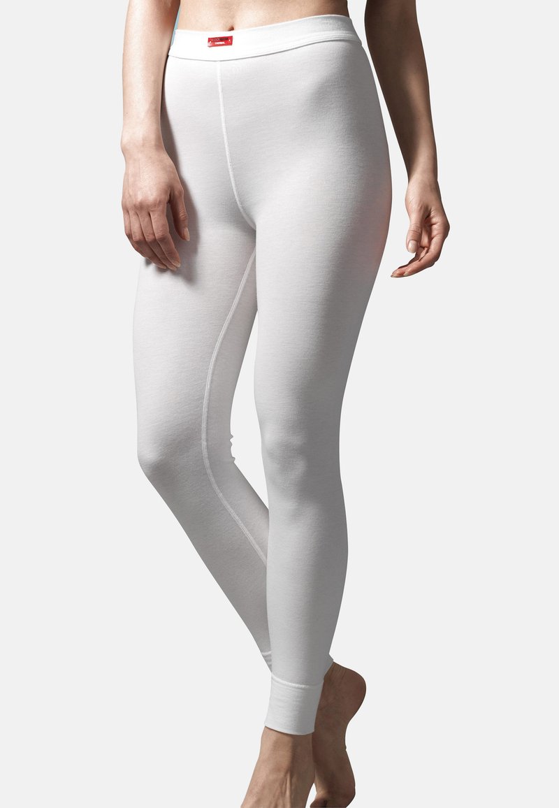 Leggings bianchi realizzati in materiale testurizzato, con vita liscia, forma aderente e polsini rinforzati.