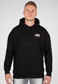 Felpa nera in cotone, con tasca a marsupio, cappuccio regolabile con stringhe e logo ricamato multicolore sul petto.