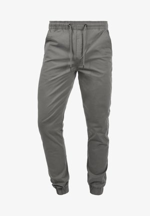 Graue Jogginghosen aus Baumwollmix mit elastischem Bund und Kordelzug, seitlichen Taschen und tapered Bündchen an den Knöcheln.