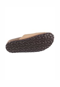 Zapatilla de ante marrón con una suela de goma texturizada que presenta patrones redondeados. La suela incluye una ligera elevación en la parte trasera.