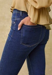 Next SUPER SOFT STANDARD - Bootcut jeans - blue embellished