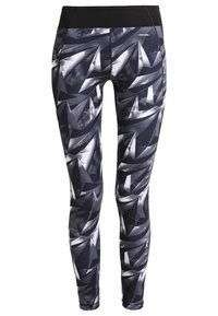 Leggings neri e grigi con un motivo geometrico, realizzati in materiale elasticizzato, caratterizzati da una superficie liscia e una vita alta.