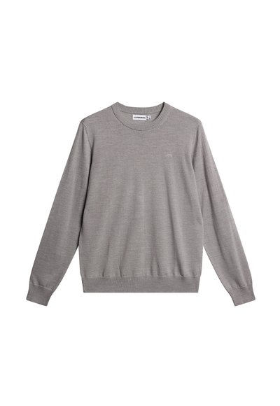 Harmaa neule, joka on valmistettu pehmeästä materiaalista. Siinä on pyöreä pääntie, ribbaus hihoissa ja helmassa sekä huomaamaton logo edessä.