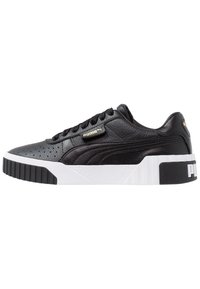 Black leather sneakers with perforated upper, lace-up closure, padded collar, and white rubber sole featuring logo detail on side.