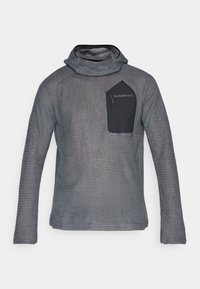 Grå teksturert hettegenser med lange ermer og en svart glidelås brystlomme merket "Peak Performance" mot en hvit bakgrunn.