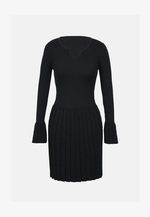 Abito nero a coste in maglia con maniche lunghe e polsini svasati, caratterizzato da un corpino aderente e una gonna plissettata sotto la vita.