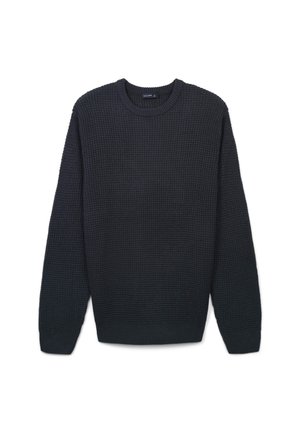 Maglione lavorato a maglia di un blu navy scuro, con scollatura a girocollo, maniche lunghe e polsini a coste. La texture presenta un classico motivo a waffle.