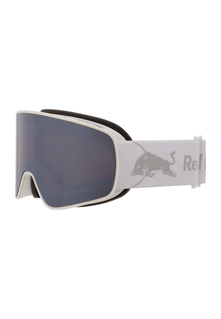 Lunettes de ski blanches élégantes avec des verres teintés foncés et une sangle blanche réglable avec un logo de taureau sur le côté.