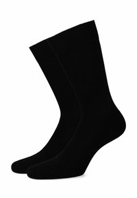 Czarne bawełniane skarpetki typu crew o gładkiej fakturze, z wzmocnionym palcem i prążkowanym paskiem na górze dla pewnego dopasowania. Brak widocznych wzorów lub akcentów.