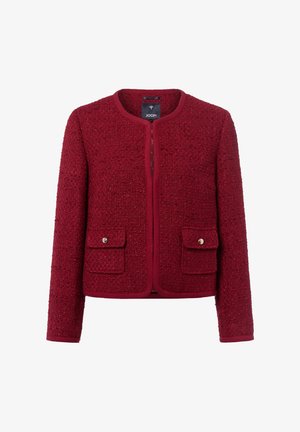 Giacca in tweed rosso texture con due tasche davanti a flap e maniche lunghe, senza colletto e con scollatura rotonda.