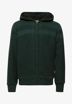 Zeleni pleteni dukserica s punim patent zatvaračem, teksturalnim uzorkom, rebrastim manžetama i donjim rubom te plišastim podstavom. Ima mali logo na donjoj strani.