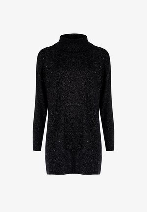 Pull à col roulé noir avec une coupe ample, des manches longues et une texture scintillante agrémentée de fils argentés.