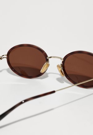 Rankning 12: Gucci - Solglasögon