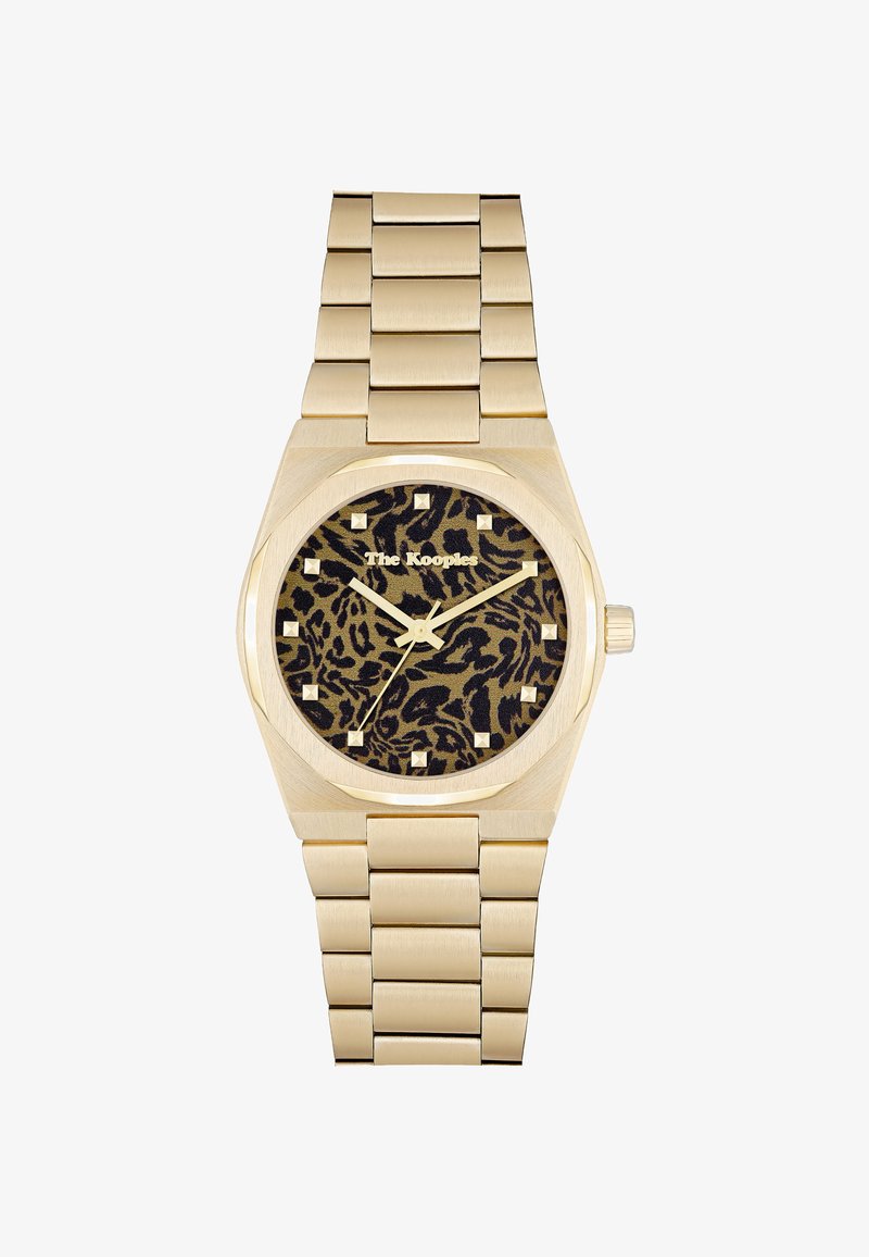 Zelta metāla rokas pulkstenis ar leoparda raksta ciparnīcu, zelta stundu marķieriem un "The Kooples" logotipu zem 12. stundas.