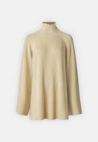 Beige ribbet genser med høyt hals og vide ermer, samt en avslappet passform. Laget av strukturert strikkemateriale, med høy krage og sømløst design.