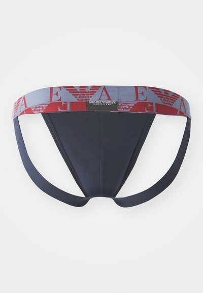 Culotte pour homme bleu marine avec une ceinture logo dans les couleurs rouge et gris. Tissu lisse avec des bretelles élastiques et un devant structuré.