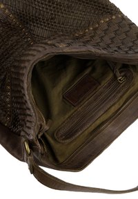 Brown leather handbag with woven texture, gold accents, and green fabric interior. Includes inner zip pocket and leather label.