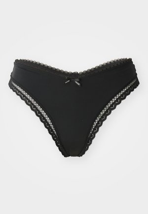 Black lace-trimmed panties with a smooth fabric. Features scalloped edges and a small bow accent with brand tags at the front.
