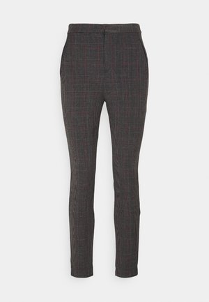 Pantalon sur mesure à motif à carreaux sombre avec des accents de gris, noir et rouge. Confectionné dans un tissu lisse avec une coupe slim.