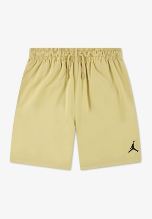 Ανοιχτό μπεζ σορτς με ελαστική μέση και κορδόνια, με μικρό μαύρο λογότυπο Jumpman στο αριστερό πόδι.