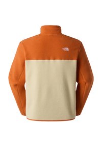 Fleece pullover met een oranje bovenstuk en een beige onderstuk. Voorzien van een hoge kraag, textuurmateriaal en een klein logo op de achterkant.