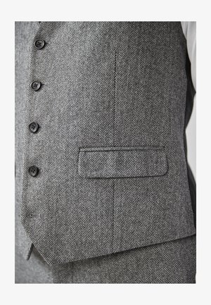 Hallgray herringbone-vest, mille tekstuuriga kangas, kuus musta nuppu ja üks tasku vasakul küljel.