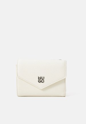 White faux leather wallet with a textured surface, featuring a flap closure, an angled design, and a silver "HUGO" logo on the front.