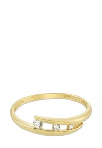 Bague en or avec un anneau lisse et poli, comportant trois pierres transparentes enfoncées, disposées de manière asymétrique. Design simple et moderne avec un détail de courbe ouverte.