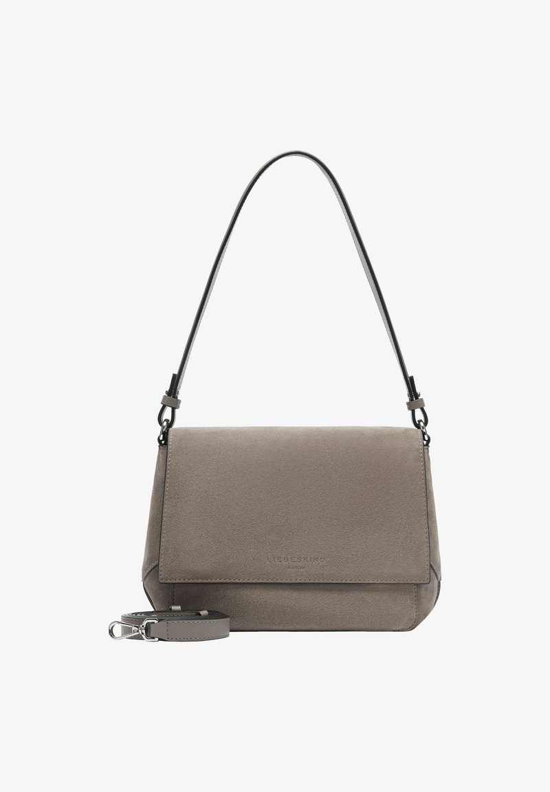 Gray suede handbag with a flap closure, adjustable shoulder strap, and logo detail on the front. Smooth texture and structured design.