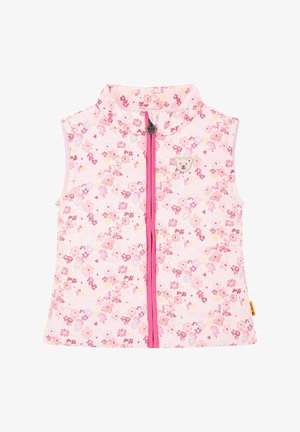 Chaleco con estampado floral sobre fondo rosa, presenta un cuello alto y un cierre frontal, acentuado por un pequeño emblema de un oso en el pecho.