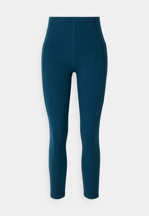 Hochtaillierte türkisfarbene Leggings aus dehnbarem Stoff, mit verstärkten Nähten, einer glatten Textur und einem schmal zulaufenden Bein.
