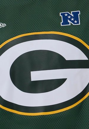 Maillot de football vert avec un grand logo "G" blanc bordé de jaune et un écusson bleu "N" avec des étoiles en haut à droite.