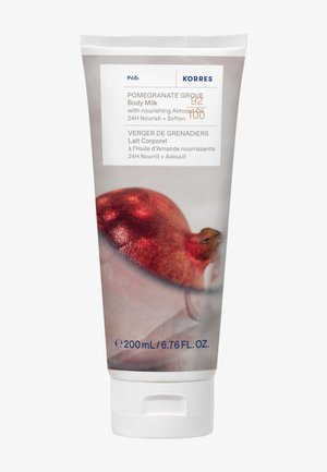 Körpermilch-Tube Pomegranate Grove von Korres mit Mandelöl, 200 ml, mit Granatapfelbild und Text in Englisch und Französisch.