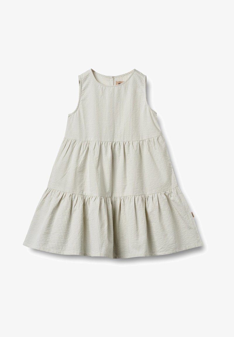 Bezramionowa sukienka w jasnym kremowym kolorze z teksturowanym, kratkowanym wzorem. Rozkloszowany, warstwowy dół, okrągły dekolt oraz zamek błyskawiczny z tyłu.