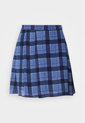 Blue plaid skirt with pleats, featuring varying shades of blue and dark navy patterns. Made from a lightweight fabric, includes subtle branding.