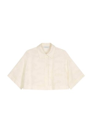Chemise courte et cintrée à manches courtes en tissu beige clair avec un motif subtil, dotée d'une fermeture à boutons et d'un col classique.
