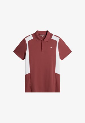 Polo color amaranto con pannelli accentuati bianchi. Presenta un collo con colletto, maniche corte e un logo sul petto sinistro. Realizzata in tessuto liscio.