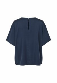 Blouse bleu marine à manches courtes avec une coupe ample et une petite fente verticale au niveau de l'encolure arrière.