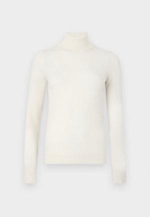 Maglione a collo alto a maniche lunghe color crema con polsini e orlo a costine, esposto su uno sfondo grigio neutro.
