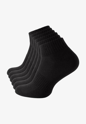 Chaussettes de cheville en coton noir, vendues par lot de six. Bord-côte aux poignets, zone des orteils renforcée et texture lisse sur l'ensemble. Design classique pour un usage quotidien.