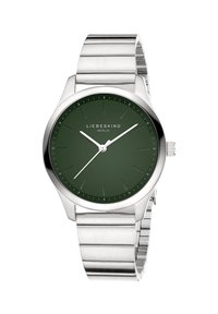 Runde grüne Zifferblatt-Uhr mit einem Armband aus silbernem Edelstahl. Merkmale sind ein minimalistisches Design, leuchtende Zeiger und dezente Stundenmarkierungen. Markenname angegeben.