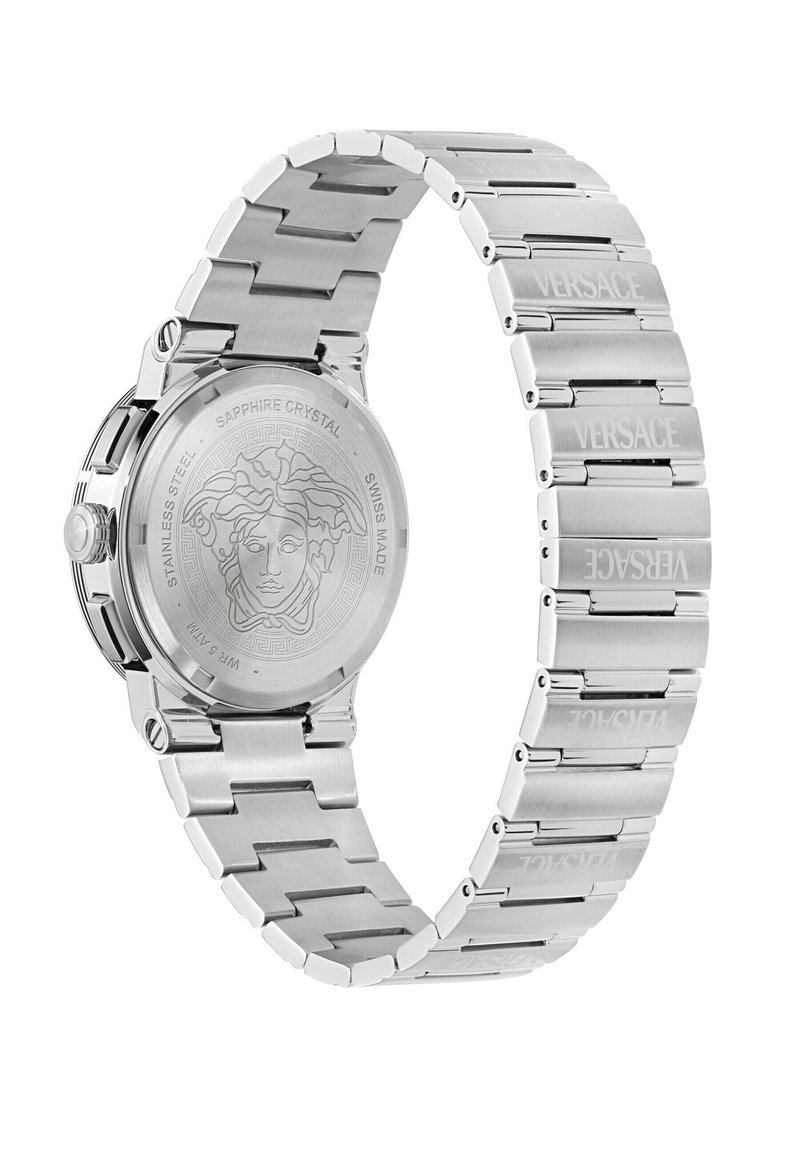 Silver stainless steel watch with a textured link bracelet, round case, and engraved back featuring a Medusa design. Sapphire crystal face.