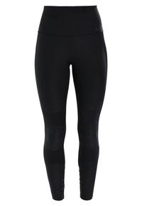 Czarne legginsy z wysokim pasem, wykonane z elastycznego materiału, z akcentami na kolanach i matową teksturą. Logo Nike na pasie.