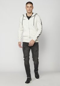 Koroshi Sudadera con cremallera - crudo
