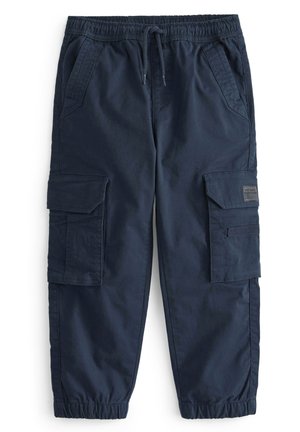 Pantalons cargo navy en coton. Caractéristiques : taille élastique, cordon de serrage ajustable et plusieurs poches latérales. Texture lisse, jambe fuselée.