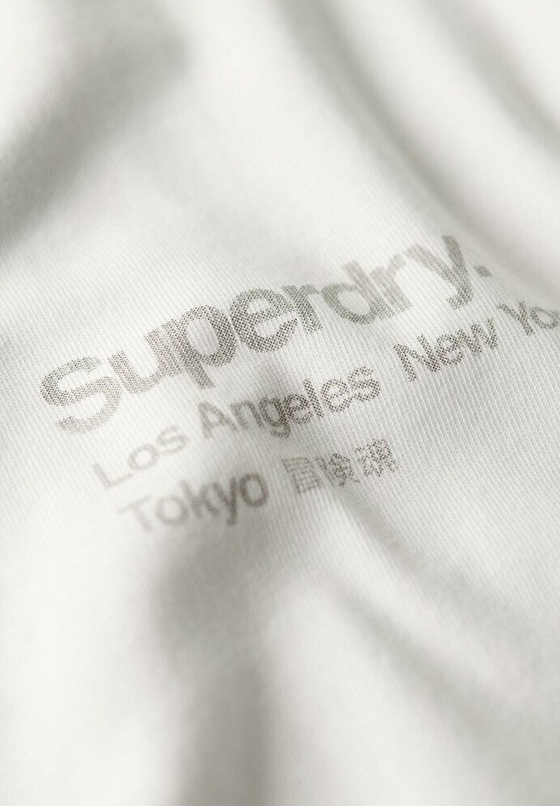 T-shirt Superdry Blanc - Taille M - Occasion En état Impeccable (comme Neuf)
