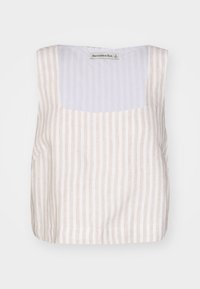 Beige och vit randig ärmlös topp med fyrkantig halsringning och mjuk textur. Etikett synlig vid halsringningen, minimalistisk design.